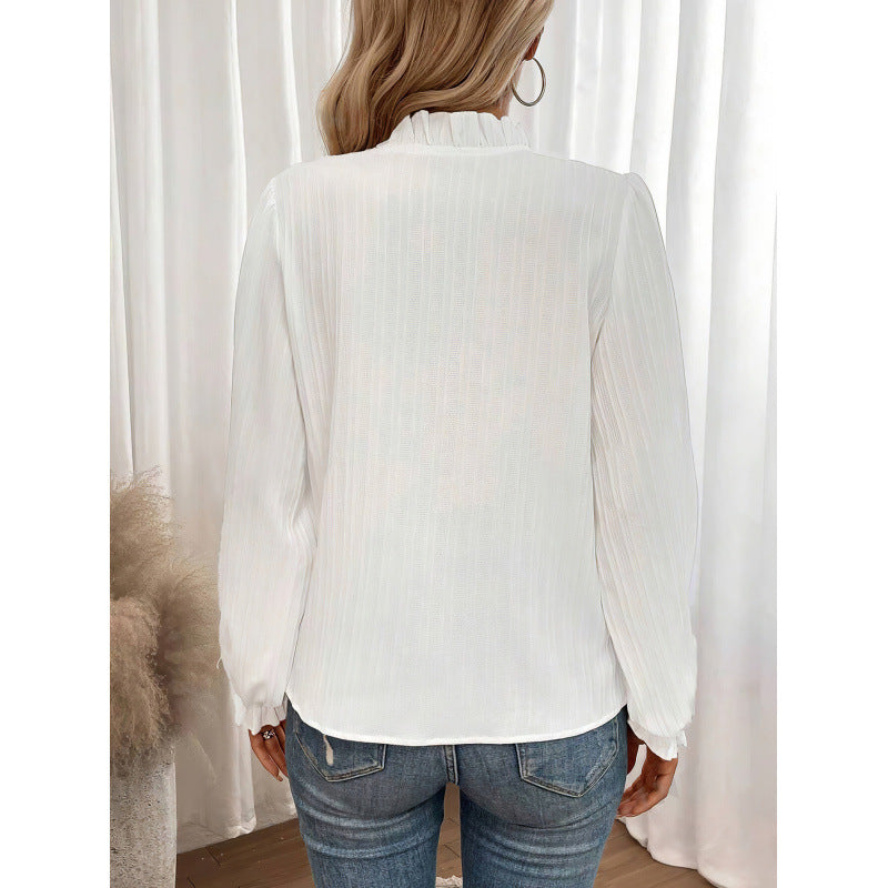 Elegant bluse for kvinner med volanger og folder