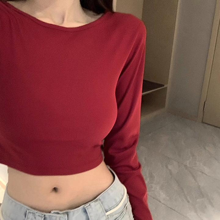 Kvinne langermet crop top med kryssrygg og elegant V-hals
