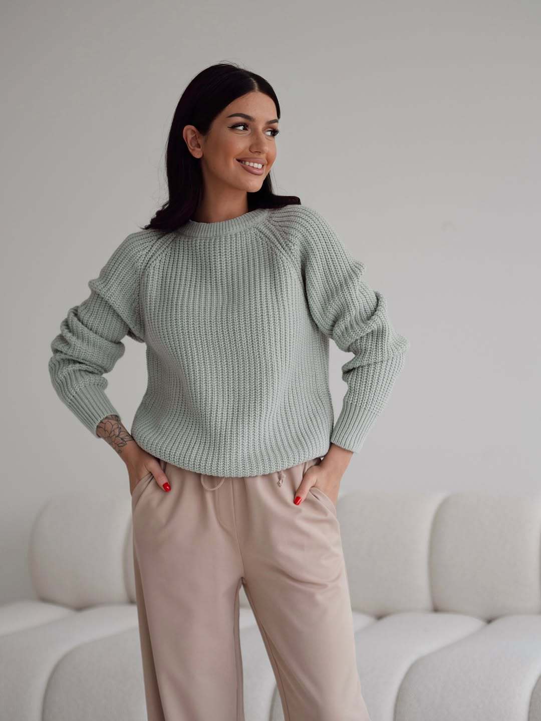 Women's knitted sweater with elegant cuffs Skjora