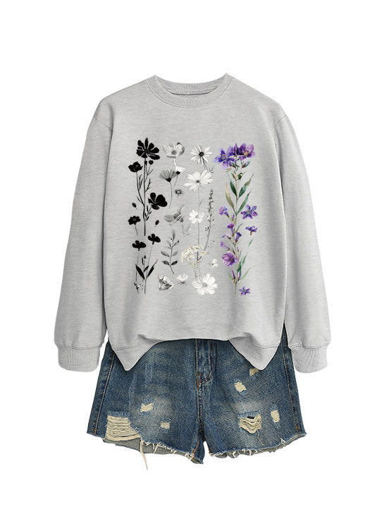Dame sweatshirt med blomster grafisk design og myk innvendig fôr Skjora
