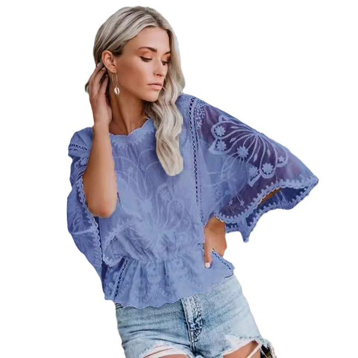 Kvinnes elegant bluse i blonde med voluminøse ermer Skjora