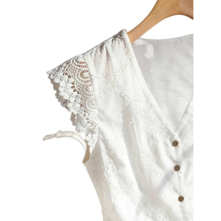 Damebluse med spiss-ermer og knappdetaljer Skjora