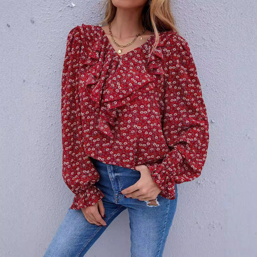 Damebluse med ruffledetaljer og blomstermønster Skjora