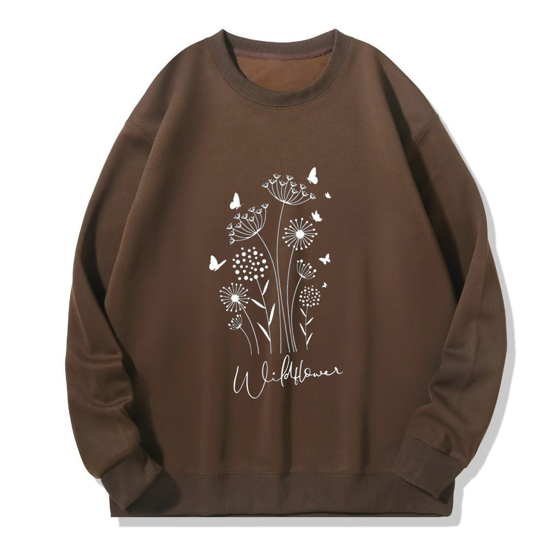 Kvinnelig sweatshirt med blomstertrykk av villblomster og koselig innerfor Skjora