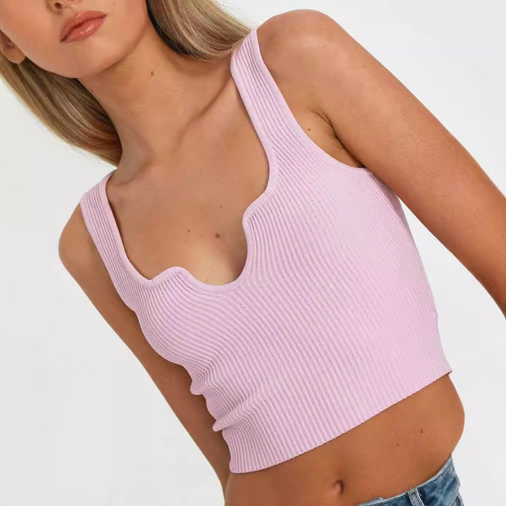 Dame Crop-top med bølget utskjæring og fin ribbestruktur Skjora