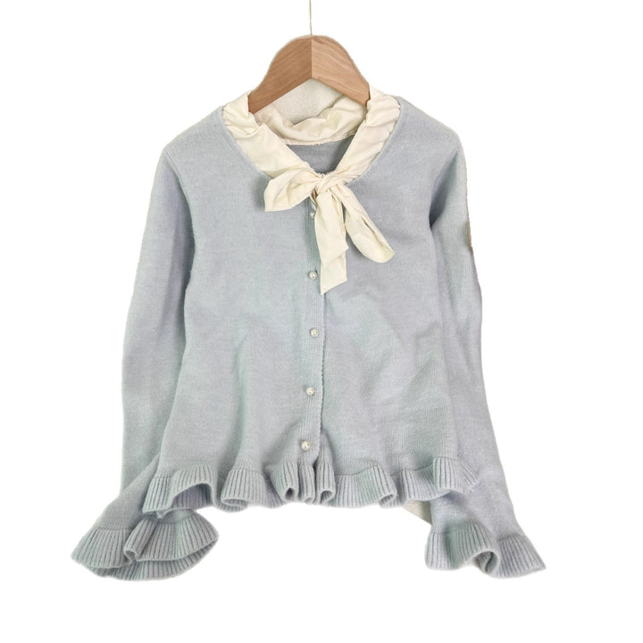 Kvinnes elegant cardigan med volanger og sløyfekrage Skjora