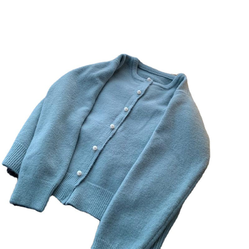 Dame cardigan med elegante perleknapper og moderne design Skjora