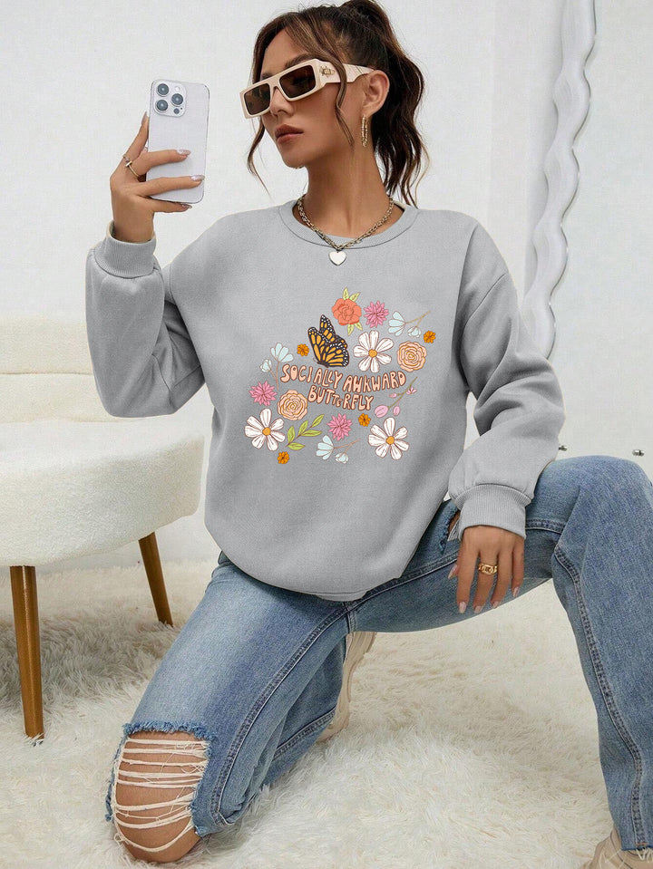 Kvinne sweatshirt med kreativt blomsterdesign og inspirerende trykk Skjora