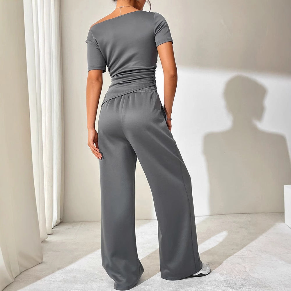 Dame jumpsuit med asymmetrisk snitt og vidbenet design Skjora