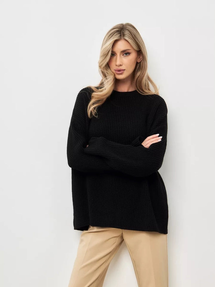 Dame casual oversized strikkegenser med åpne ermekanter og lett ribbestrikket mønster Skjora