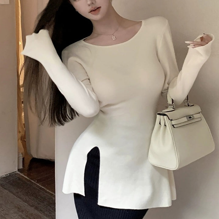 Kvinne langermet topp med asymmetrisk kutt og elegant detalj