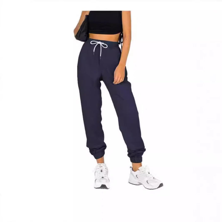 Kvinne sporty joggebukser med praktisk snor og elastisk liv.