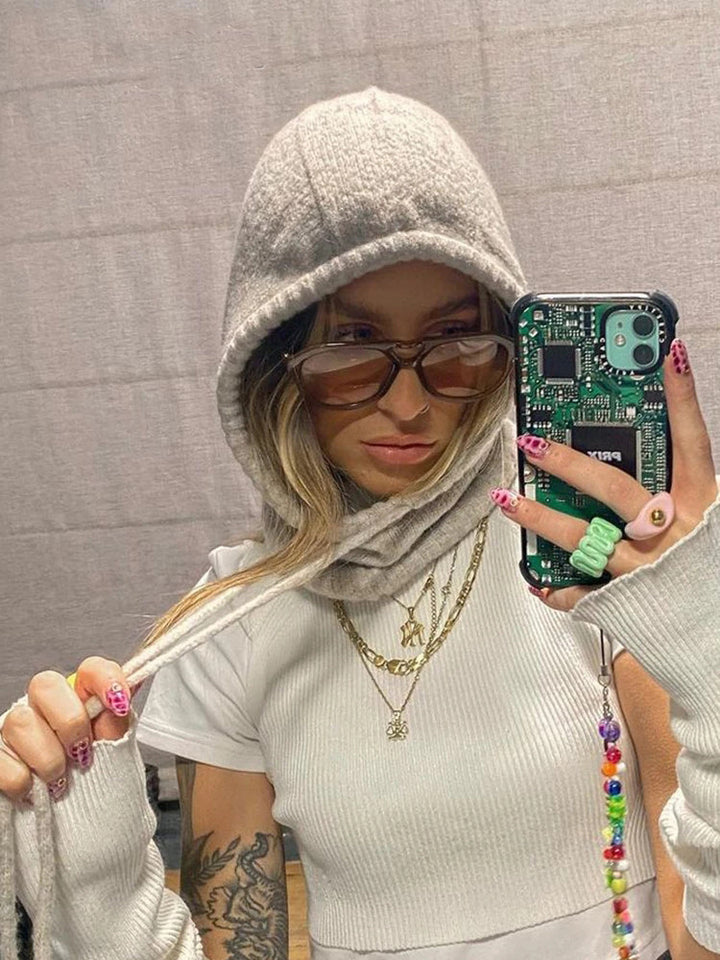 Ladies fashionably knitted top with hood and long sleeves Skjora