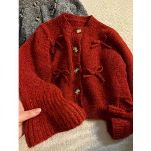 Dame cardigan med dekorative sløyfer på