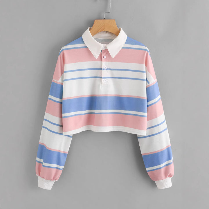 Dame polo skjorte i en avslappet crop design med et stilfullt fargeblokk mønster Skjora