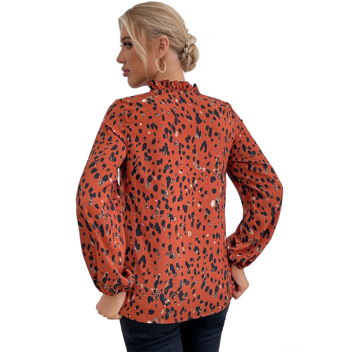 Kvinnes bluse med blomstret leopardmønster og voluminøse ermer Skjora