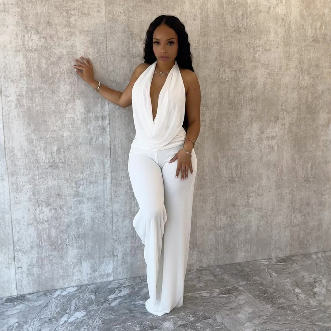 Dame jumpsuit med elegant innpakningsdetalj og vide benpartier Skjora