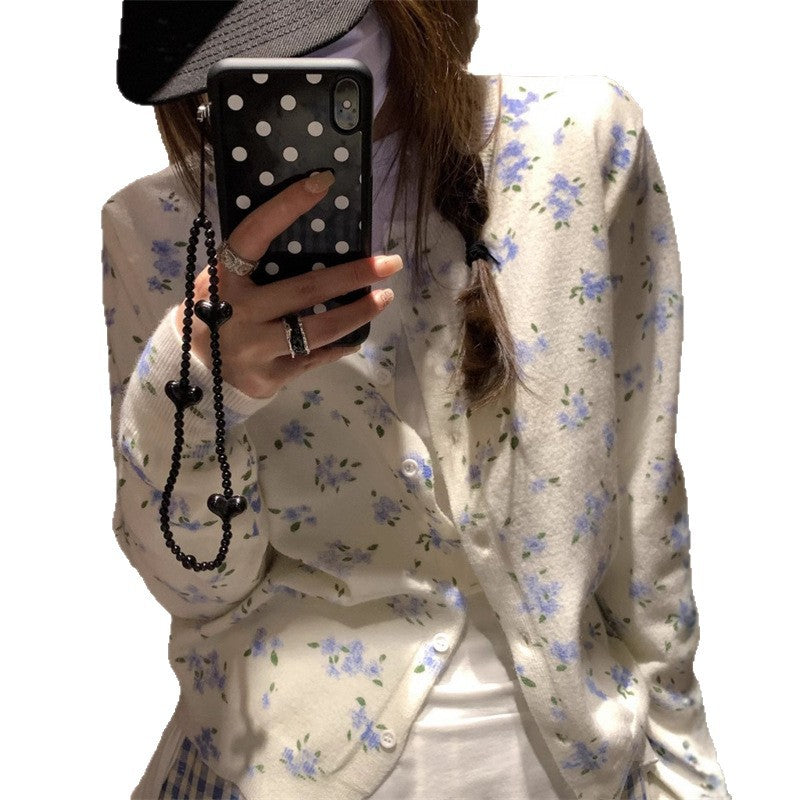 Dame cardigan med blomstermønster og knappeåpning Skjora