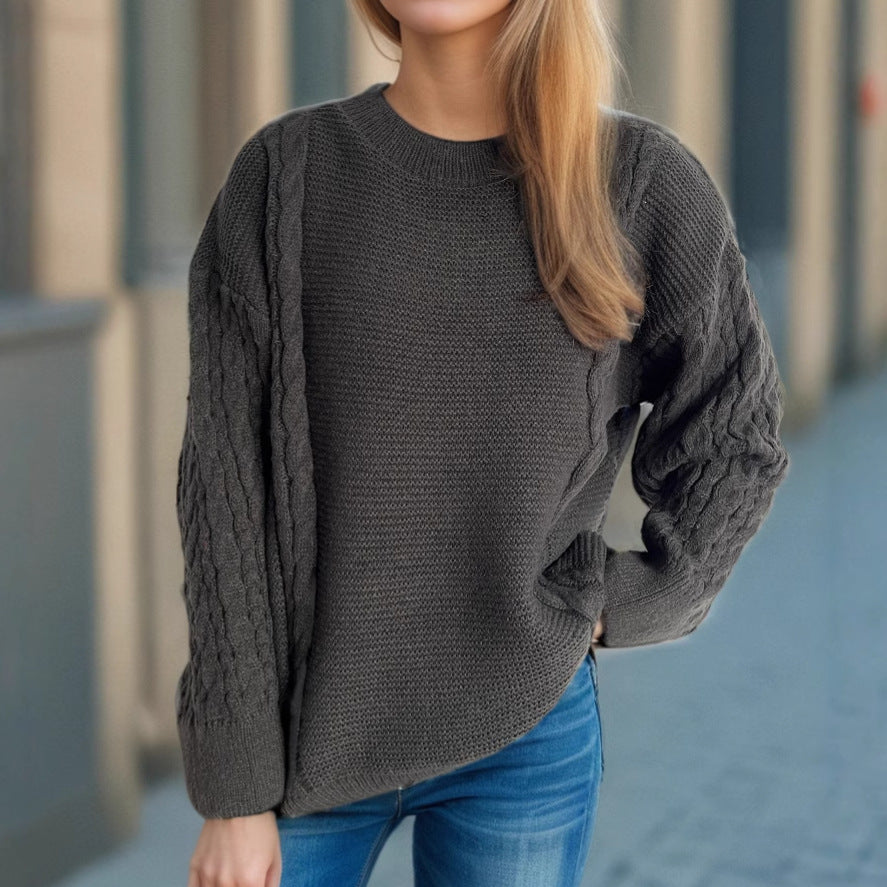 Kvinne chunky strikkegenser med kabeldesign og voluminøse ermer Skjora