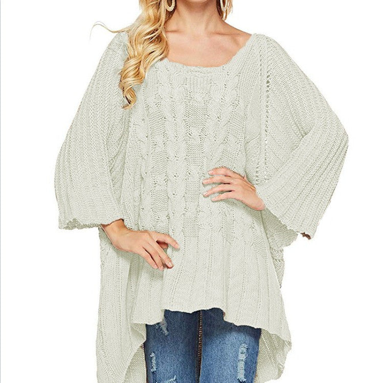 Kvinnes chunky strikket poncho med trendy kabelforløpning og brede ermer Skjora