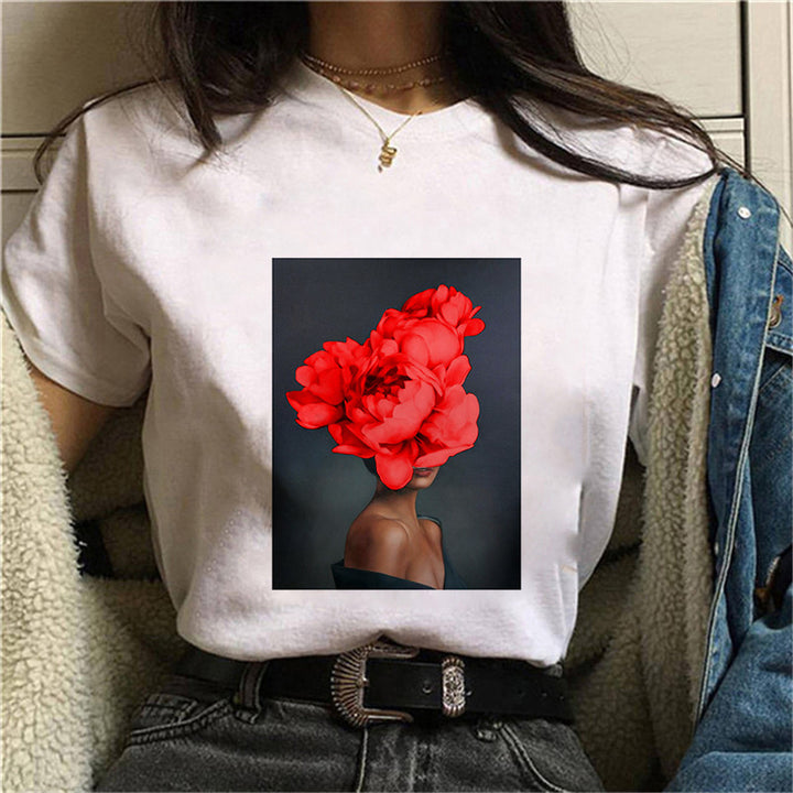 Dame T-skjorte med blomstertrykk og kreativt kunstmotiv Skjora