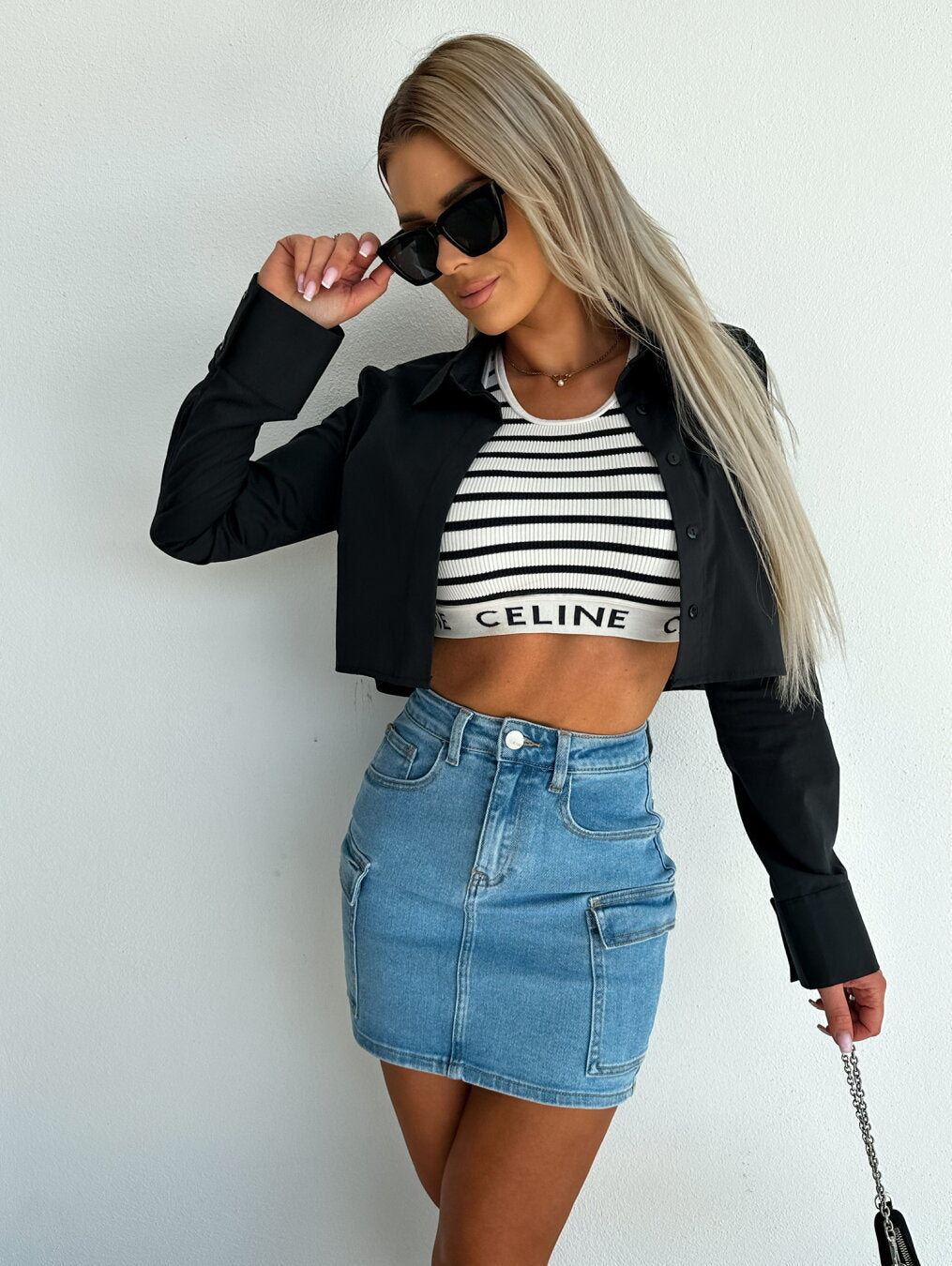 The woman's short jacket with an elegant cut and fashionable details.