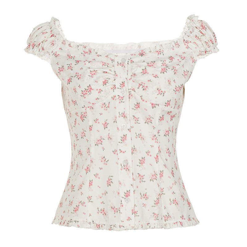 Damebluse med blomsterdesign og volangdetaljer Skjora