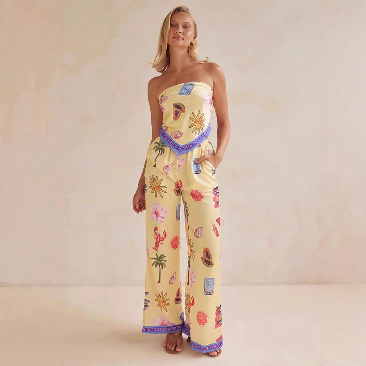 Kvinnens jumpsuit med lekne tropiske mønstre og elastisk topp Skjora