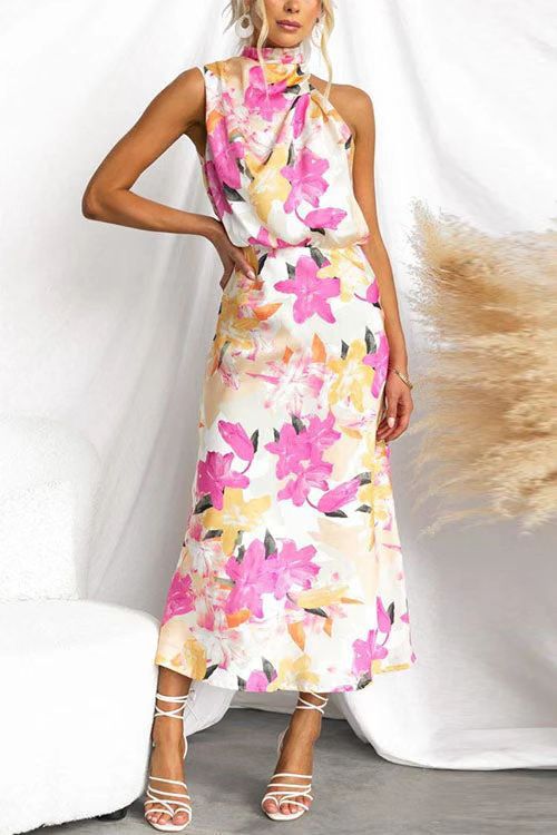 Kvinnens maxi kjole med asymmetrisk topp og blomsterprint Skjora