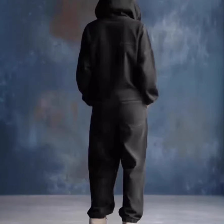 Kvinnes avslappet denim jumpsuit med hette og praktiske lommer Skjora