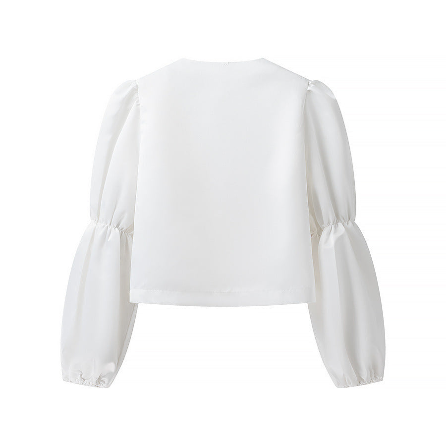 Kvinnens elegant skreddersydde bluse med voluminøse ermer Skjora