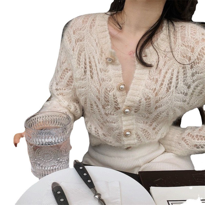 Dame cardigan med åpenmønster og elegante knapppdetaljer Skjora