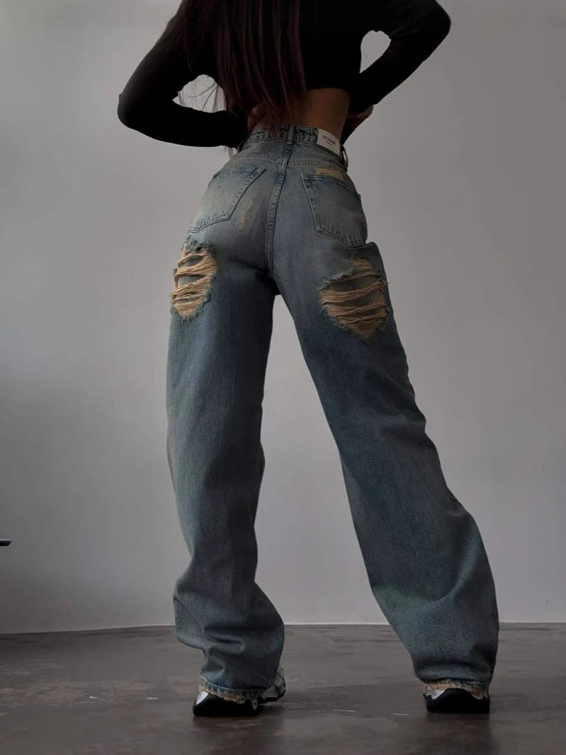 Kvinnenes Baggy Jeans i Vintage Stil med Slitte Detaljer og Høy Midje Skjora