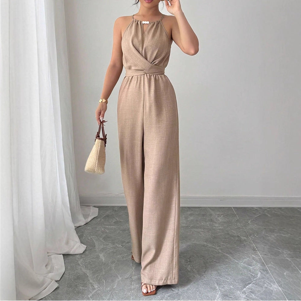 Dame gulvlengde jumpsuit med raffinert omslagdesign og elegant midjebånd Skjora