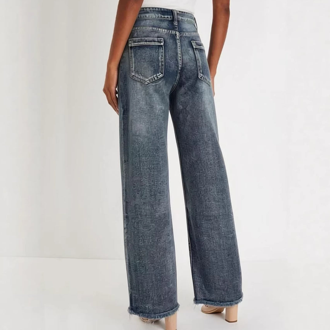 Dame vidde denim-jeans med kreativt mønster og frynset kant Skjora