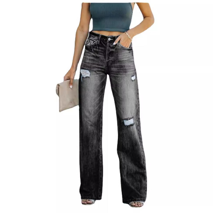 Kvinnelige vidde jeans med slitte effekter og høy liv
