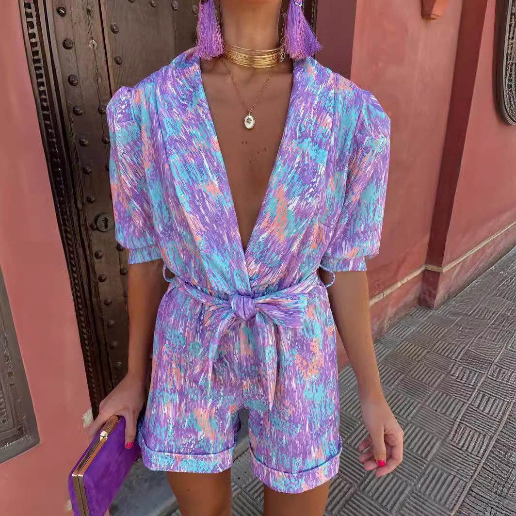Kvinnelig Elegant Jumpsuit med Dyp V-hals og Knappbar Belte Skjora