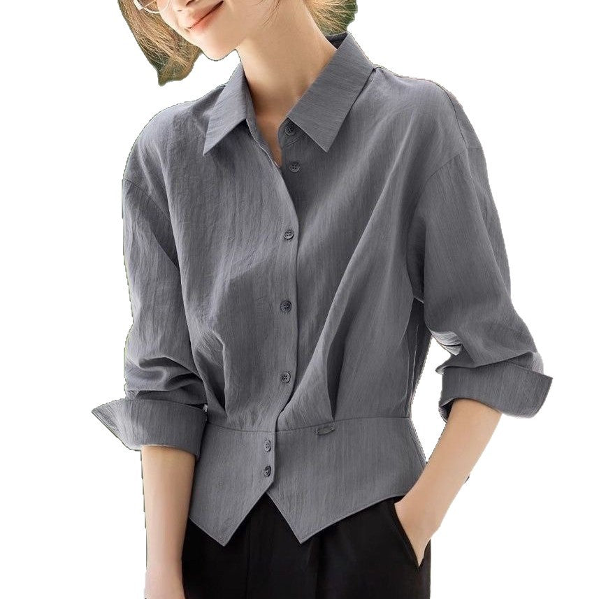 Kvinnes elegant oversized bluse med livbelte Skjora