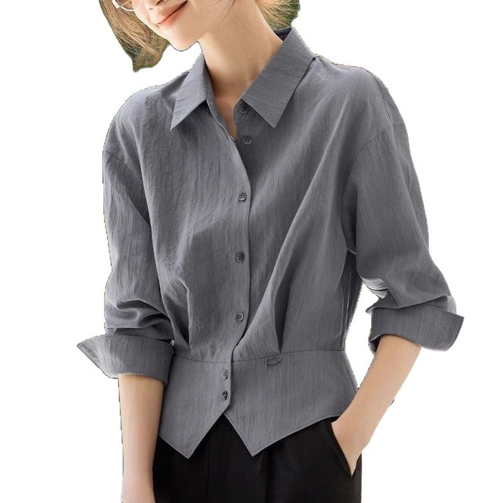 Kvinnes elegant oversized bluse med livbelte Skjora