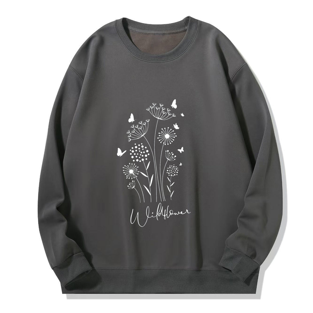 Kvinnelig sweatshirt med blomstertrykk av villblomster og koselig innerfor Skjora