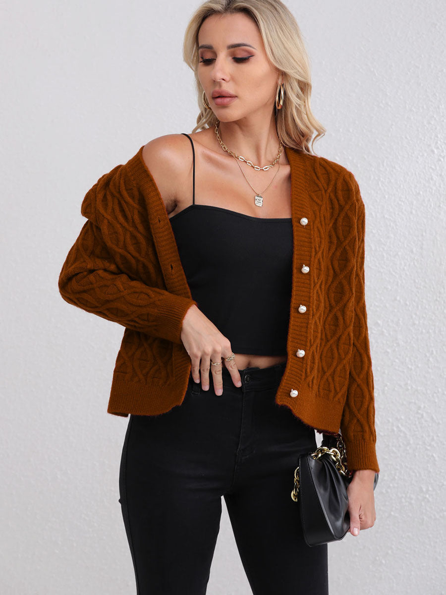 Women's designer cardigan with cable pattern and soft colors Skjora