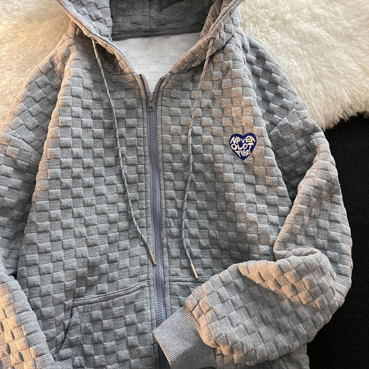 Dame hoodie-jakke laget av strukturelt materiale med praktiske lommer og fashionable design