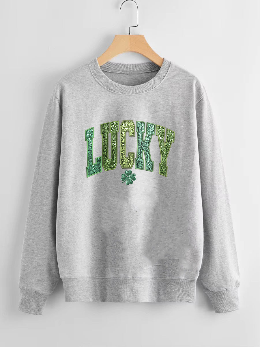 Dame uformell sweatshirt med glitrende skrift og firkløvermotiv Skjora