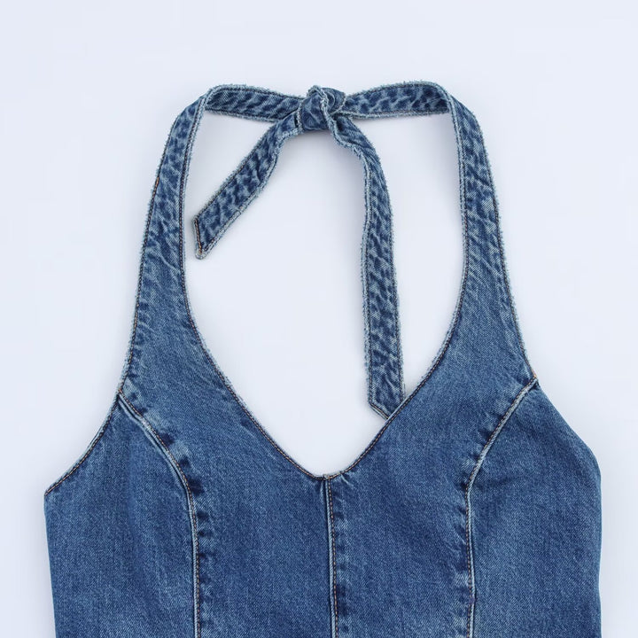 Dame jumpsuit laget av denim med kryssbånd Skjora