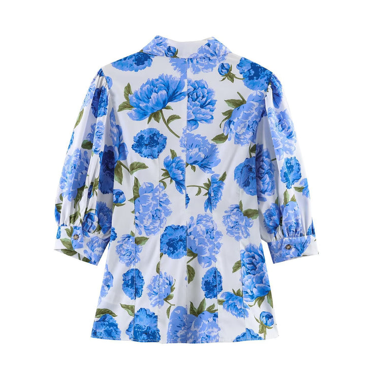 Damebluse med blomsterdesign og elegante puffermedeer Skjora