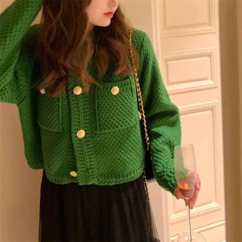 Dame cardigan med dekorative knapper og teksturert design Skjora