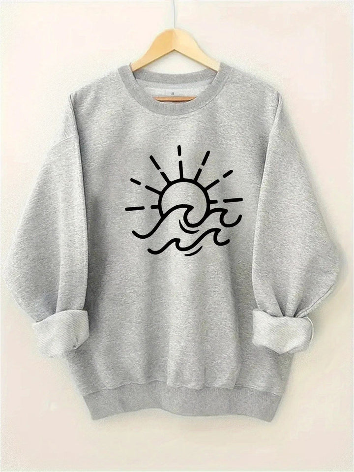 Dame sweatshirt med kreativ sol- og bølgedesign Skjora
