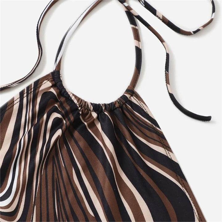 Damer trendy halterneck topp med elegant omslag-design og grafisk trykk Skjora