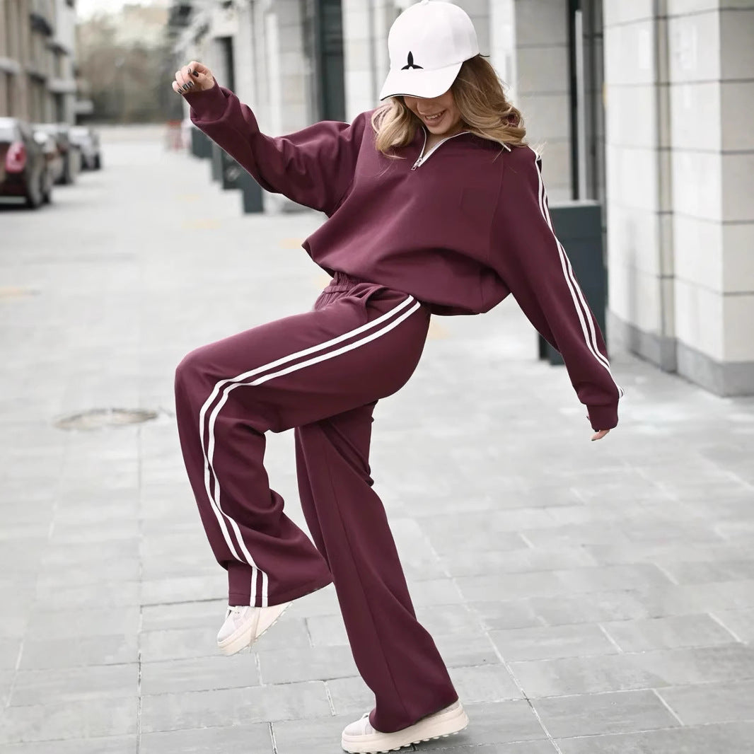 Kvinnelig sporty treningsdress med glidelås og striper Skjora