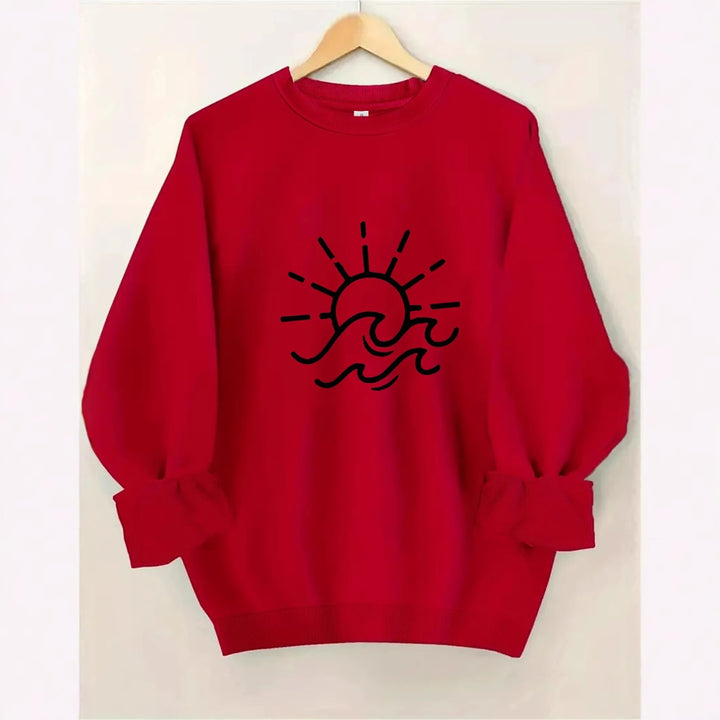 Dame sweatshirt med kreativ sol- og bølgedesign Skjora